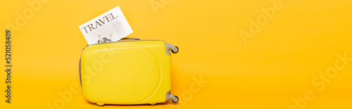 travel newspaper colorful suitcase yellow
