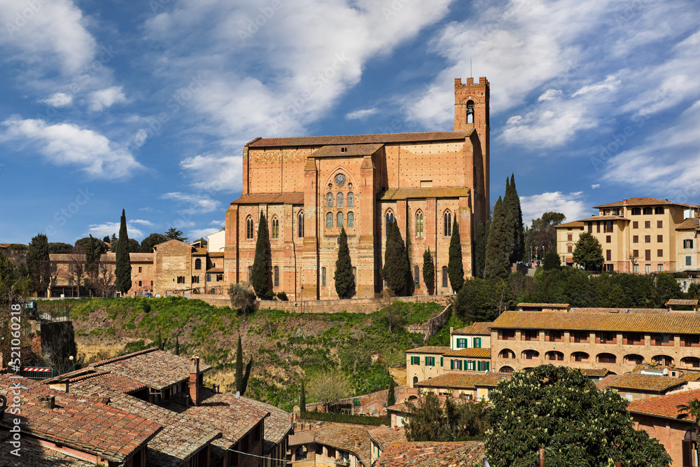 Siena, Tuscany, Italy: cityscape with the medieval church Basilica of San Domenico on the hill in the old town of the city