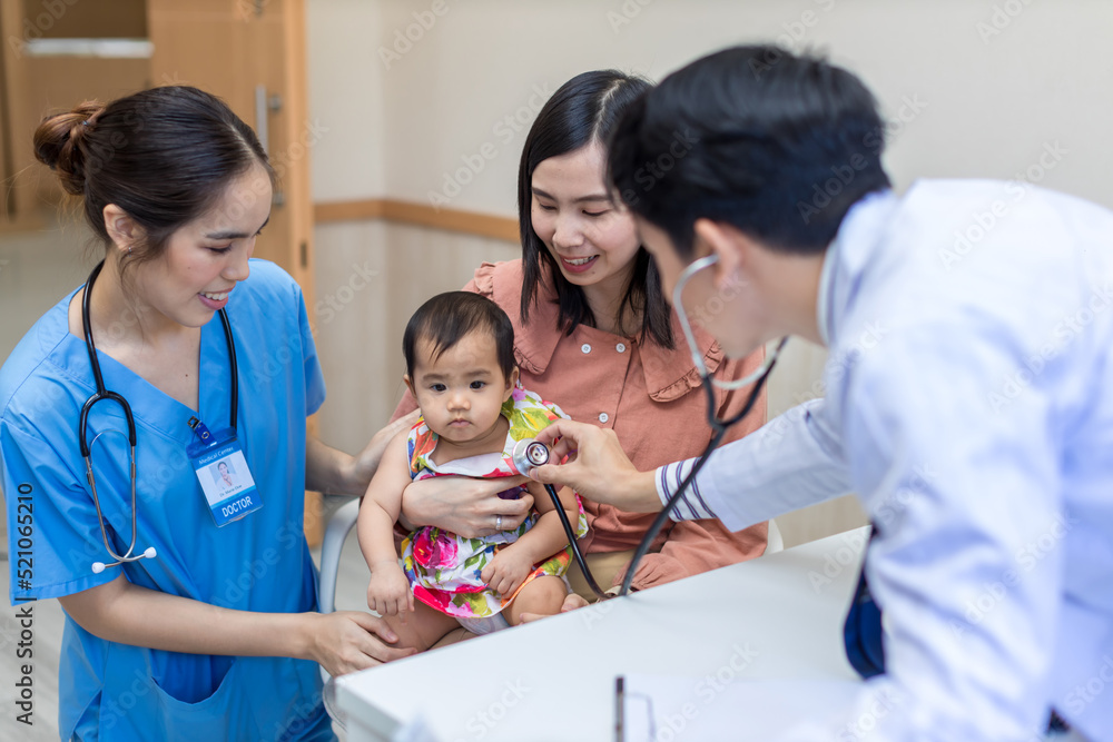baby being checked by a doctor using a stethoscope. Pediatrician doctor prepare for examines baby with stethoscope checking heart beat. baby being checked by a doctor using a stethoscope. Pediatrician doctor prepare for examines baby with stethoscope checking heart beat.