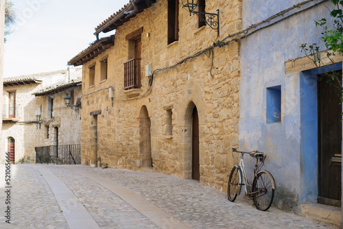 Picturesque spanish old town street with an old bicycle © ROM