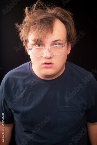 fat nerd man with messy hair and crooked glasses