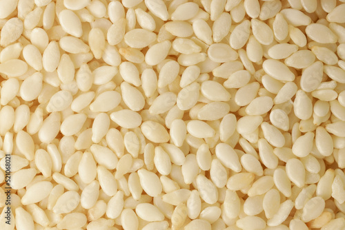 Raw white Sesame seeds, close-up. Natural background of sesame seeds.
