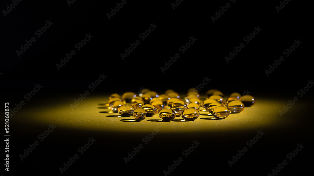 dietary supplements low key copy space. vitamin d-3 supplement softgels isometric view. immune protection care concept dietary supplements low key copy space. vitamin d-3 supplement softgels isometric view. immune protection care concept
