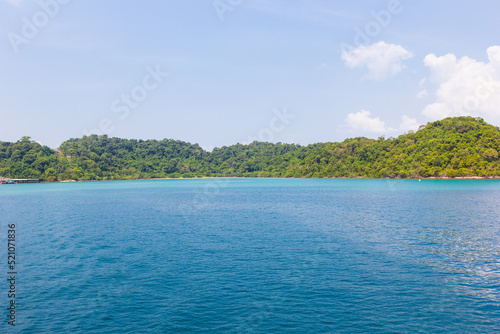 An island in the beautiful tropical sea, blue sky, and green sea © death_rip
