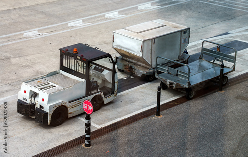 Car and trolleys for transporting suitcases at the airport.