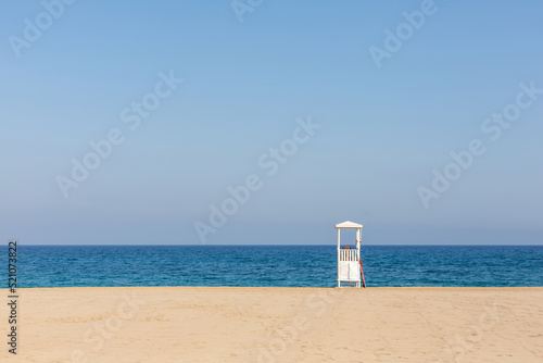 Lifeguard tower on the beach, sandy coast © ali