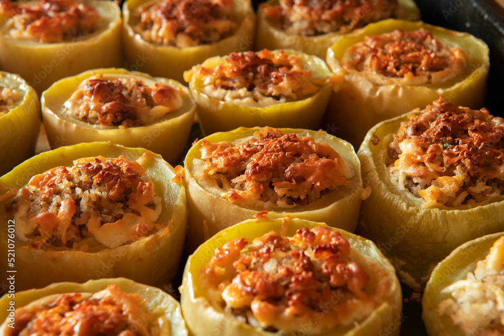 zucchini stuffed with meat and rice and baked in the oven, seasonal autumn cuisine, traditional Ukrainian food zucchini stuffed with meat and rice and baked in the oven, seasonal autumn cuisine, traditional Ukrainian food