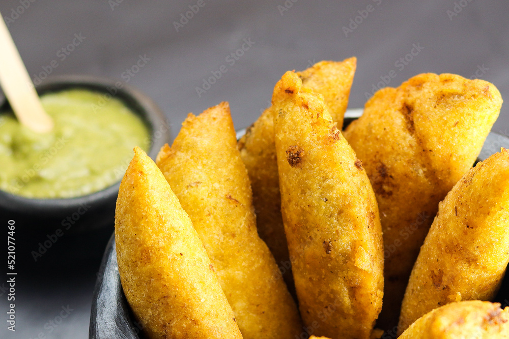 corn empanada typical Colombian food with spicy sauce corn empanada typical Colombian food with spicy sauce