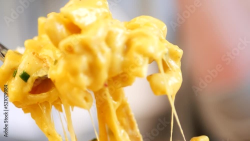 Cheese tearing apart from mac n' cheese dish  photo