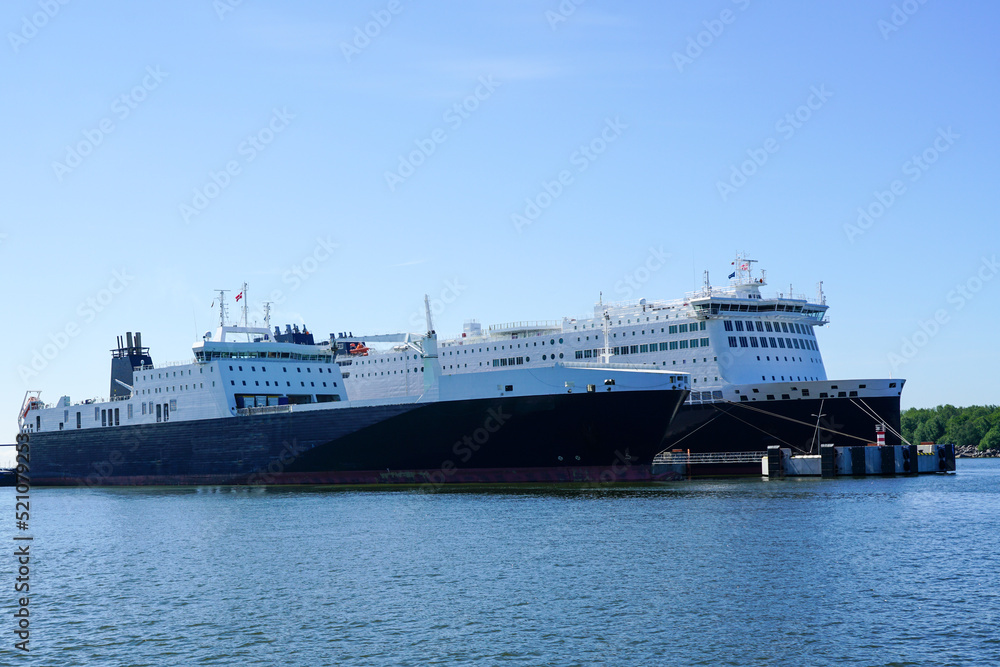 Two large cargo and passenger ferries moored in the harbor