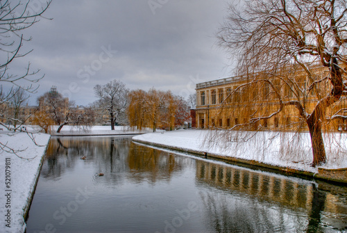 Winter in Cambridge with snow on banks of the University of Cambridge. Gloomy winters day.