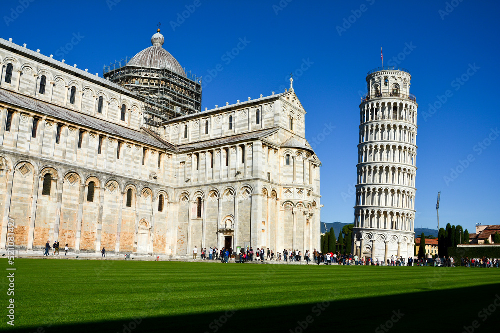 Side view of the Pisa Cathedral with the Leaning Tower of Pisa in the background, Pisa, Italy