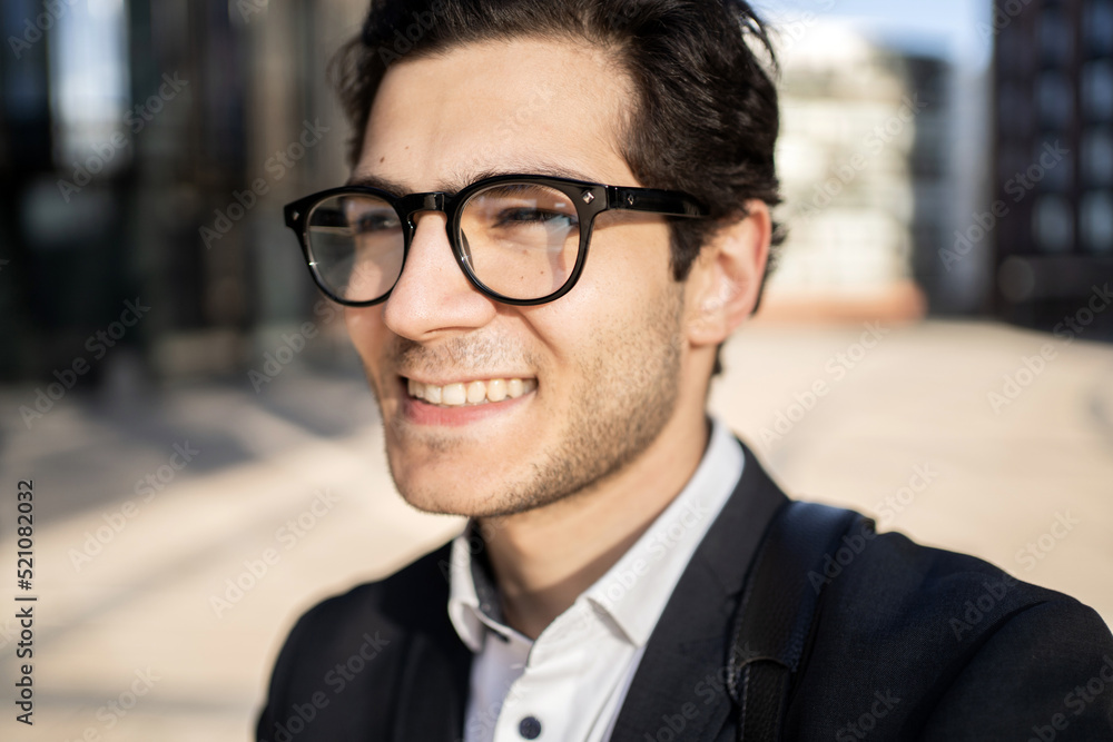 Portrait of a confident manager smiling looking away Portrait of a confident manager smiling looking away
