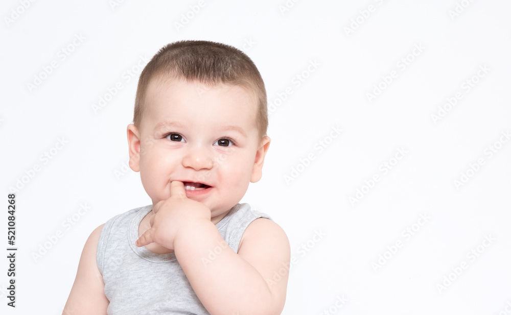 Image of cute baby boy, closeup portrait of adorable child isolated on white background, sweet toddler healthy childhood, perfect caucasian infant, lovely kid, finger in mouth teeth concept Image of cute baby boy, closeup portrait of adorable child isolated on white background, sweet toddler healthy childhood, perfect caucasian infant, lovely kid, finger in mouth teeth concept