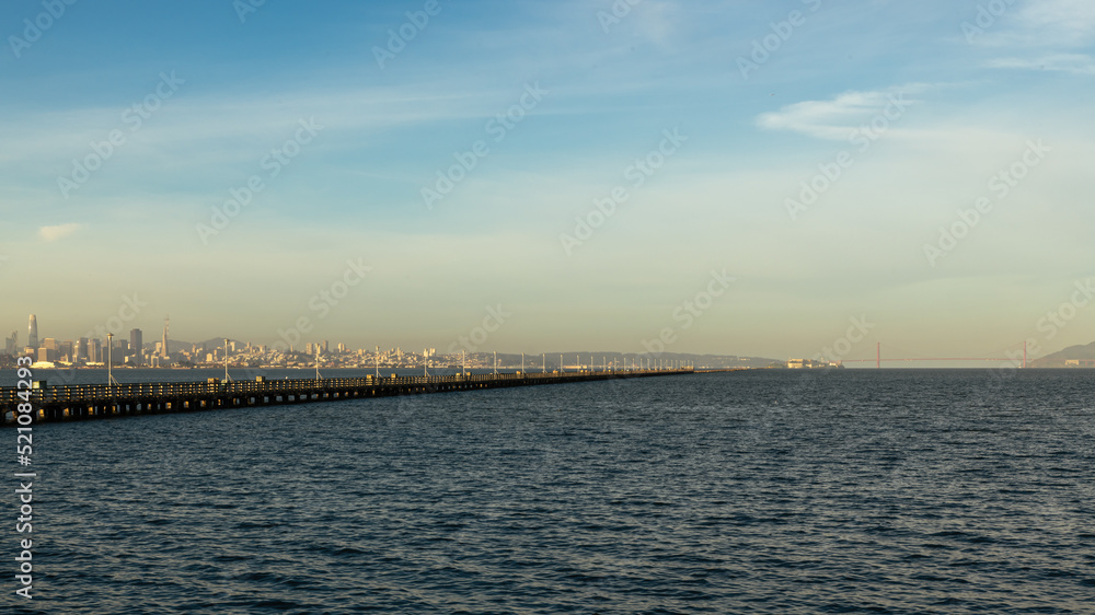 Berkeley pier view of bay waters and skyline of city and Golden Gate Bridge