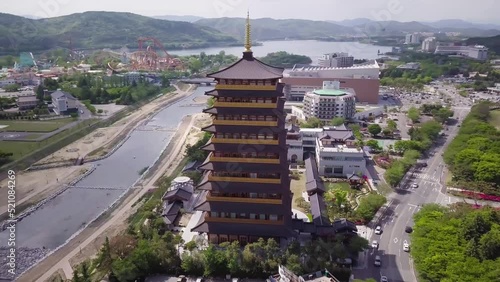 Aerial footage of a Scenic view of tall eight floors pagoda in traditional korean style village in Gyeongju in South Korea. Close to Expo areal. High quality 4k footage. photo