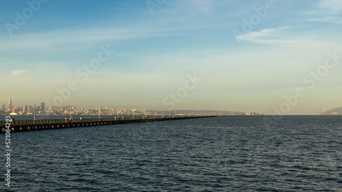 Berkeley pier view of bay waters and skyline of city and Golden Gate Bridge