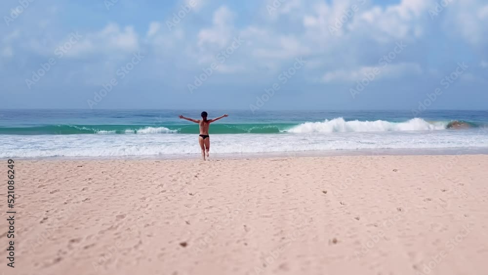Young Asian women exercising outdoor run sea background. Young caucasian female exercising outdoors running amazing seashore. Concept healthy running exercise. Active, sporty athlete jogging, a Aerial Young Asian women exercising outdoor run sea background. Young caucasian female exercising outdoors running amazing seashore. Concept healthy running exercise. Active, sporty athlete jogging, a Aerial