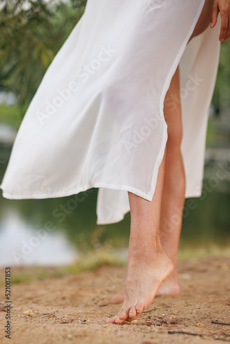 feet on the beach on the sand. Summer vacation.