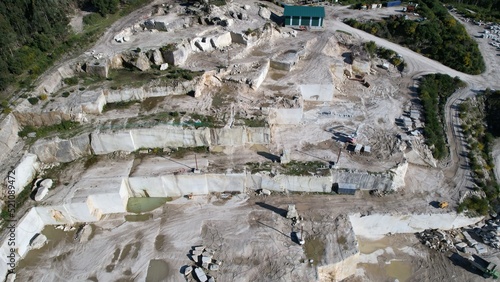 Canvas-taulu aerial photography of stone quarry where you can see the cuts made in the mounta