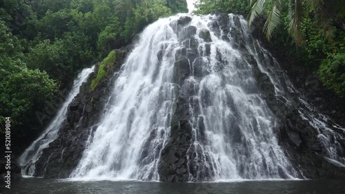 Kepirohi Waterfall inside the jungle in Pohnpei, Micronesia. Tropical exotic waterfall in wild nature of Micronesia. High quality 4k footage photo