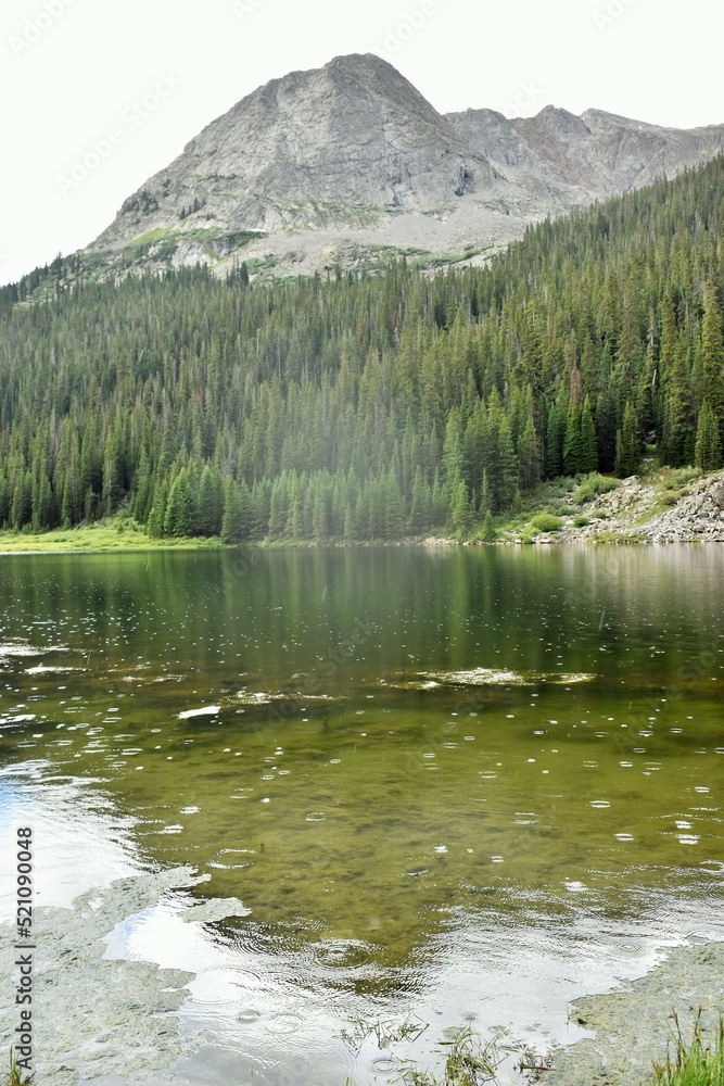 Raindrops falling on an alpine lake