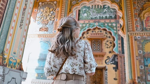 Asian woman traveling at the art of Patrika gate The ninth gate of Jaipur in Rajasthan India
