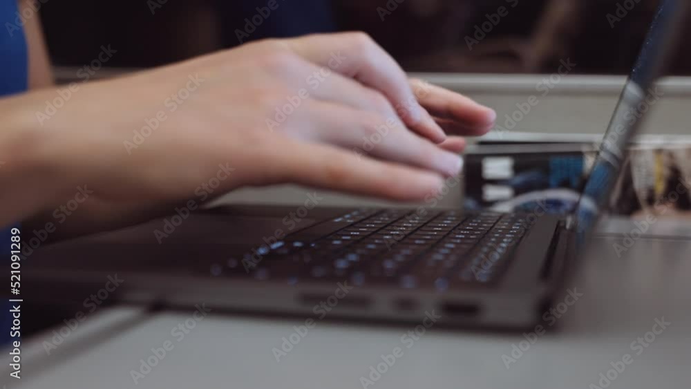 Close-up of Womans Hands Typing on a Laptop While Going by Train in the Evening Close-up of Womans Hands Typing on a Laptop While Going by Train in the Evening