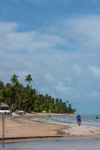 Brazil, Alagoas, 2021, january 21st A long beach with tourists enjoying a summer day in northeast Brazil