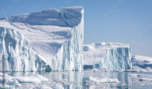 Towering great icebergs in the Ilulissat Icefjord in Greenland