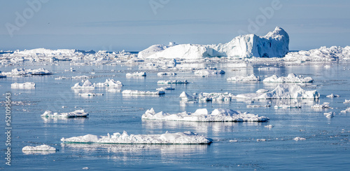 Expanse of large icebergs in the icefjord at Ilulissat, Greenland