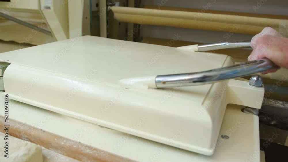 Manufacture of bakery products. The baker is making dough products. Manufacture of bakery products. The baker is making dough products.