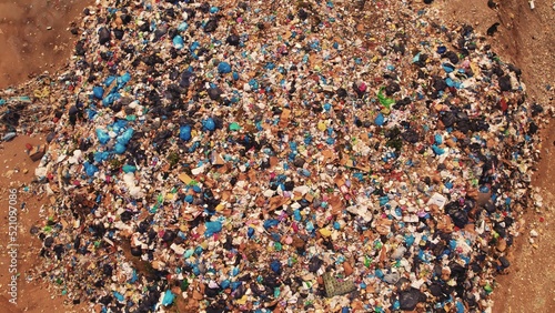 Drone aerial view of plastic waste polluting the Earth. Recycling and its lack concept. Dark side of consumerism. High quality photo