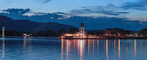 Magog harbor dock and lighthouse at night Memphremagog lake sunset light water and sky photo