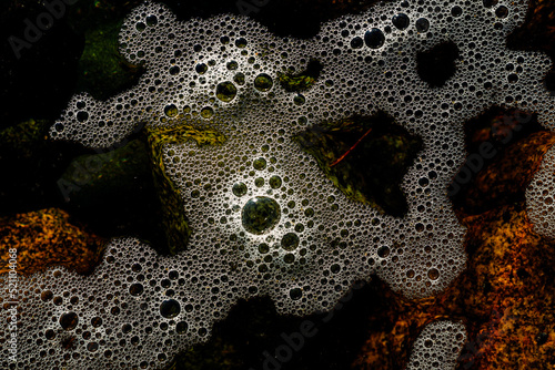 Canvas Print Sea foam scum on ocean water texture