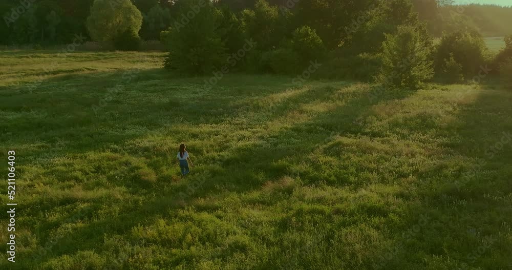 beautiful view from air on woman walking in nature in sunrise or sunset, 4K Prores beautiful view from air on woman walking in nature in sunrise or sunset, 4K Prores