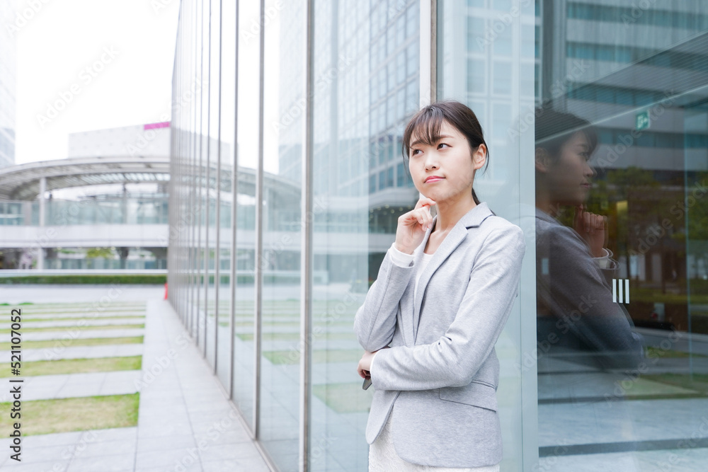 Business woman thinking in the office district