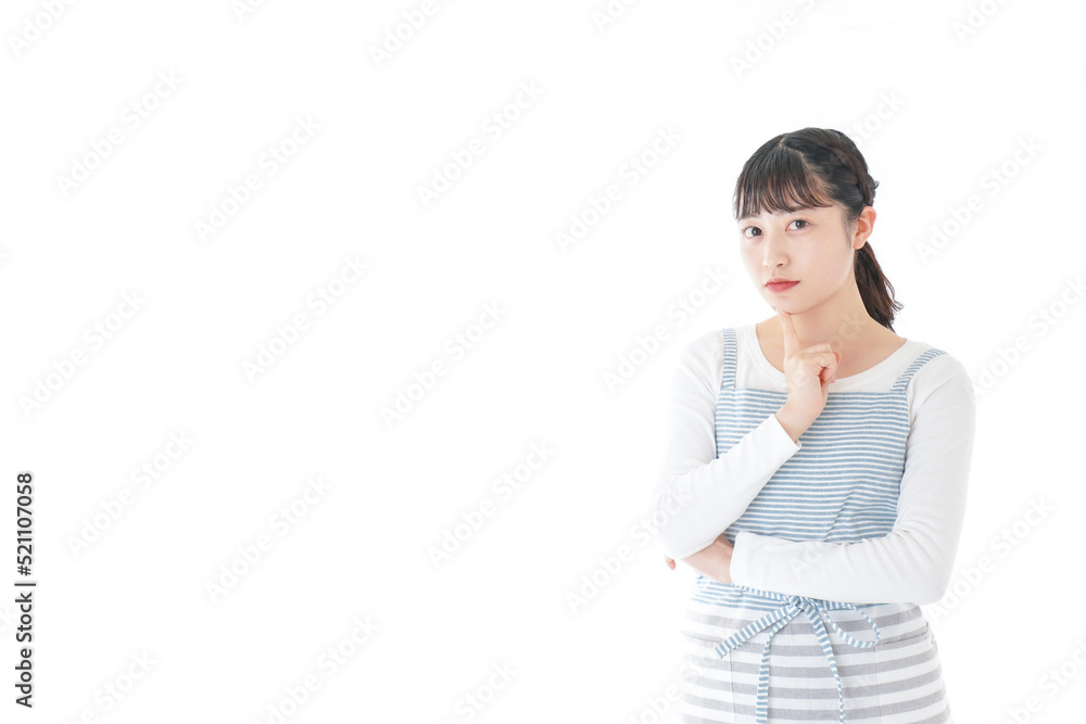 Young housewife thinking about something Young housewife thinking about something