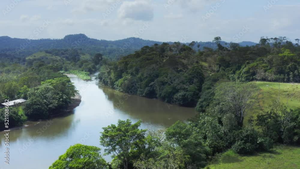 Aerial Drone View of Rainforest River and Mountains Scenery in Costa Rica at Boca Tapada, San Carlos River (Rio San Carlos) that Connects to Nicaragua in Central America, High Shot Above Trees Aerial Drone View of Rainforest River and Mountains Scenery in Costa Rica at Boca Tapada, San Carlos River (Rio San Carlos) that Connects to Nicaragua in Central America, High Shot Above Trees