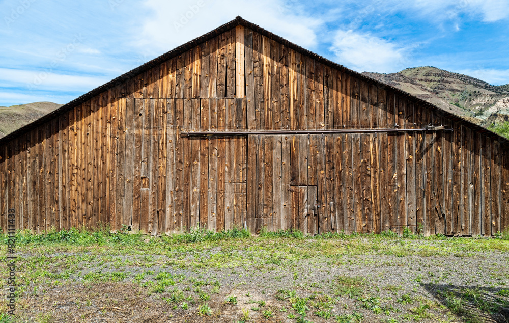 The front of an old wood barn on a ranch in central Oregon, USA The front of an old wood barn on a ranch in central Oregon, USA