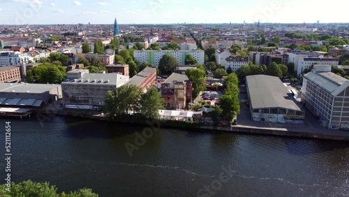 Beach party location on the Spree.
Gorgeous aerial view flight pedestal down drone footage
of sage club beach Berlin Kreutzberg sunny Summer day 2022. Cinematic view from above by Philipp Marnitz photo