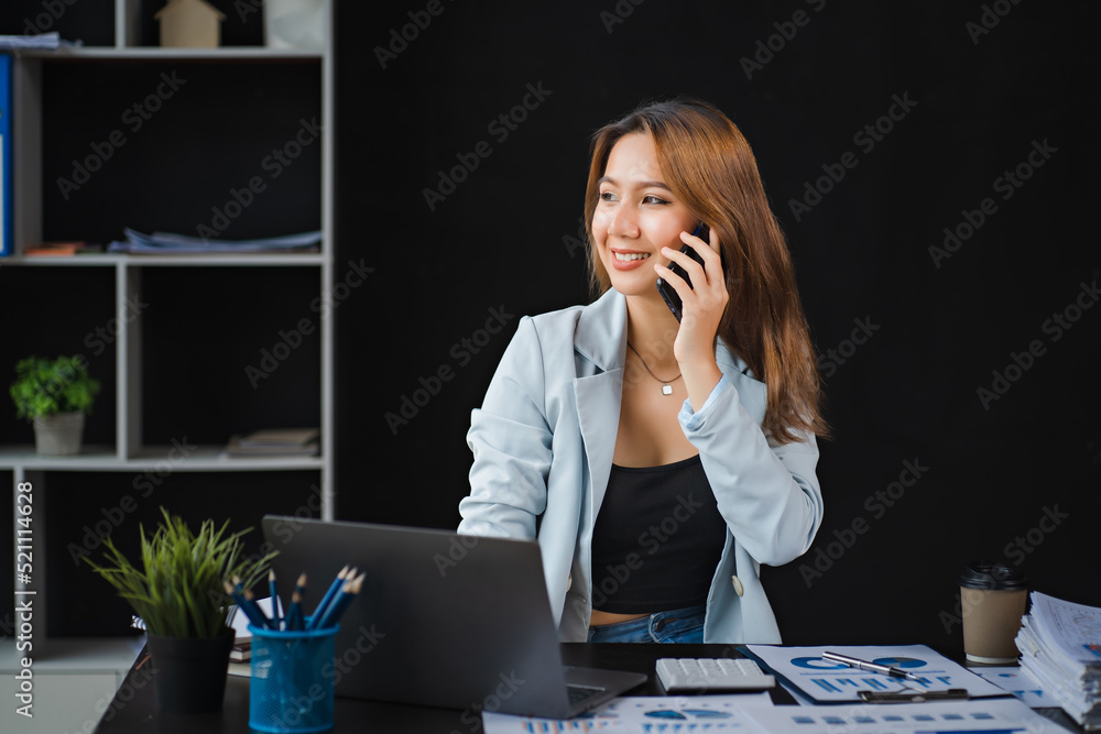 Young asian businesswoman beautiful charming smiling and talking on the mobile phone in the office.
Young asian businesswoman beautiful charming smiling and talking on the mobile phone in the office.