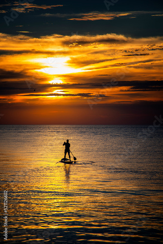 silhouette of a person with a surfboard © SKYDIVECOP