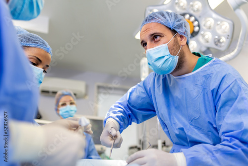 Surgery medical team operating in a surgery room of the hospital surgeon leading an operation profession professionalism occupation teamwork medical people doctors concept