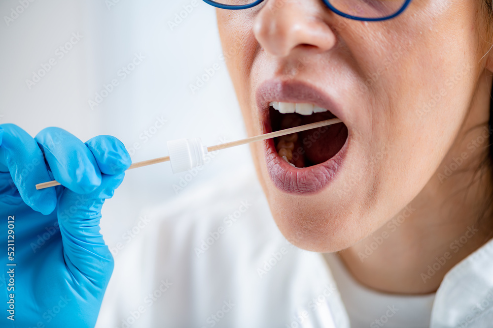 Taking a mouth swab for DNA analysis Taking a mouth swab for DNA analysis