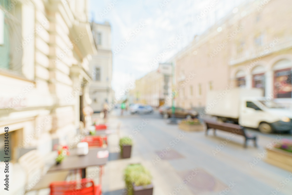 Obraz premium Blurred background of a city street. Blurred photo of a modern city.