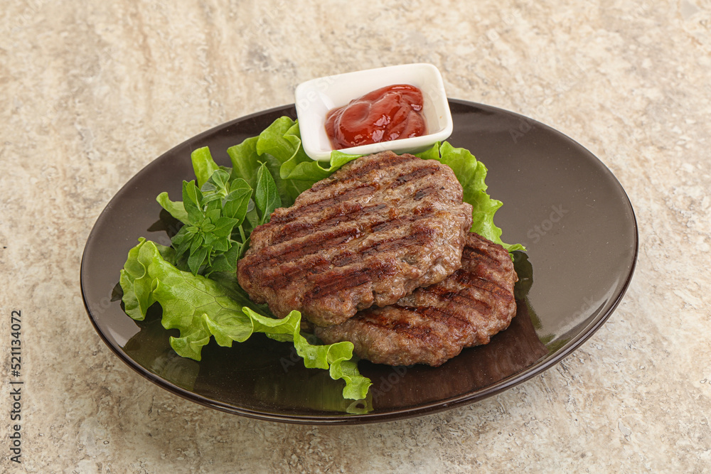 Grilled beef burger cutlet with sauce Grilled beef burger cutlet with sauce
