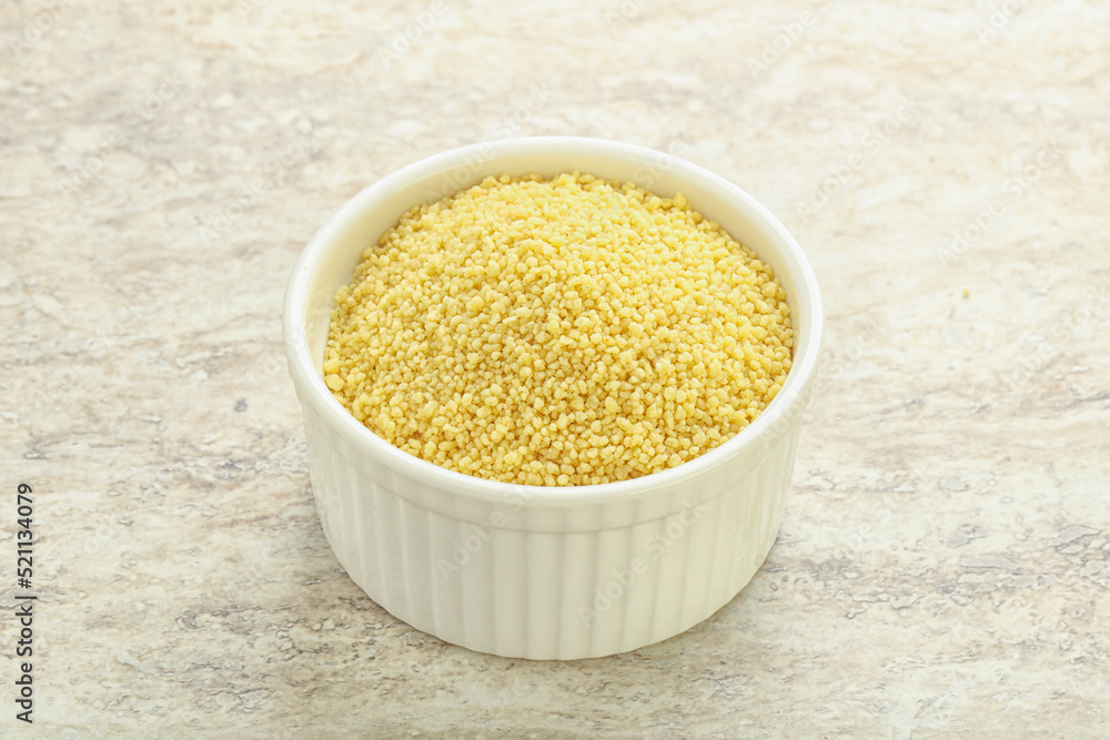 Raw couscous in the bowl Raw couscous in the bowl