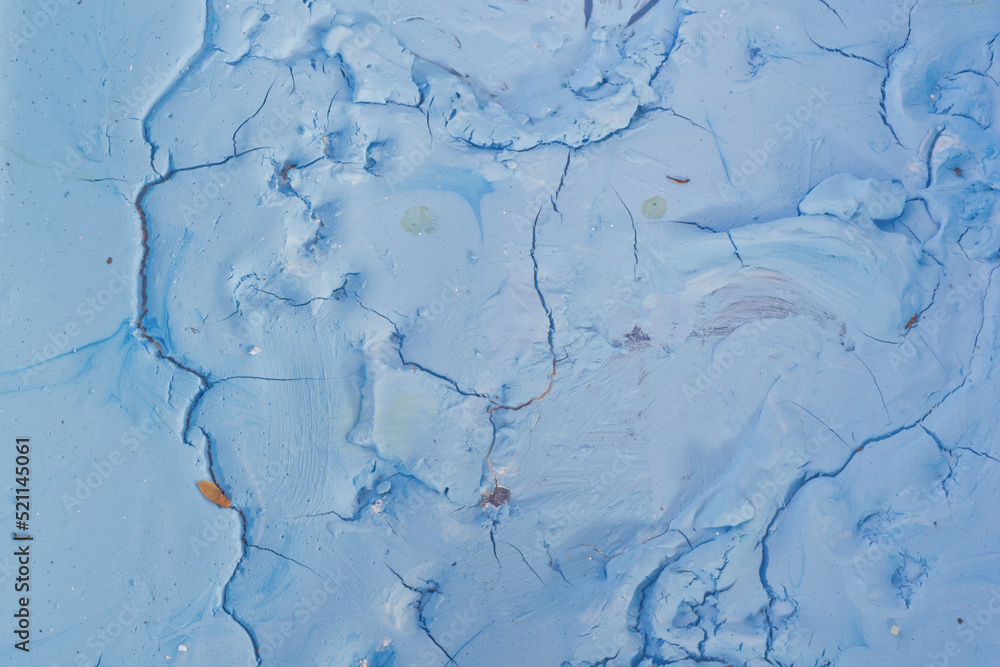 Dry blue oil paint cracks and crevices texture for background
