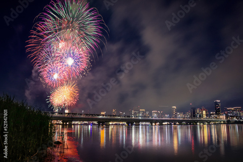 The Japanese Fireworks Festival is held every summer. The center of the event in Osaka City is on the Yodo River (Yodogawa). photo